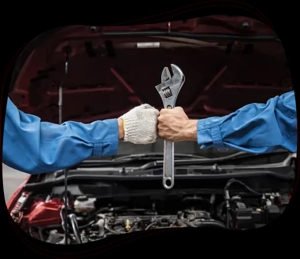 Technician checking a car engine