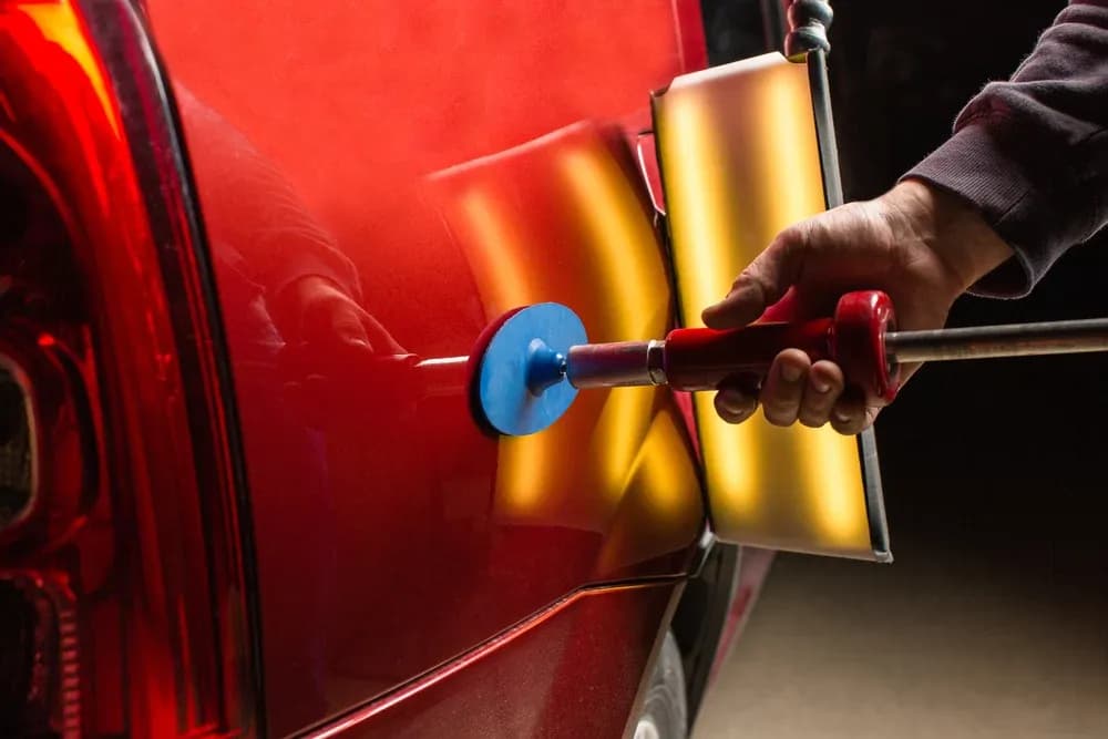 Car dent repair using a puller tool
