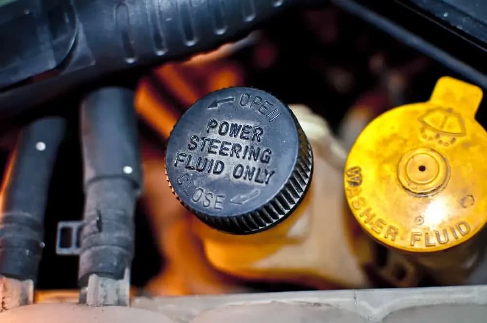 Technician ready for power-steering fluid service
