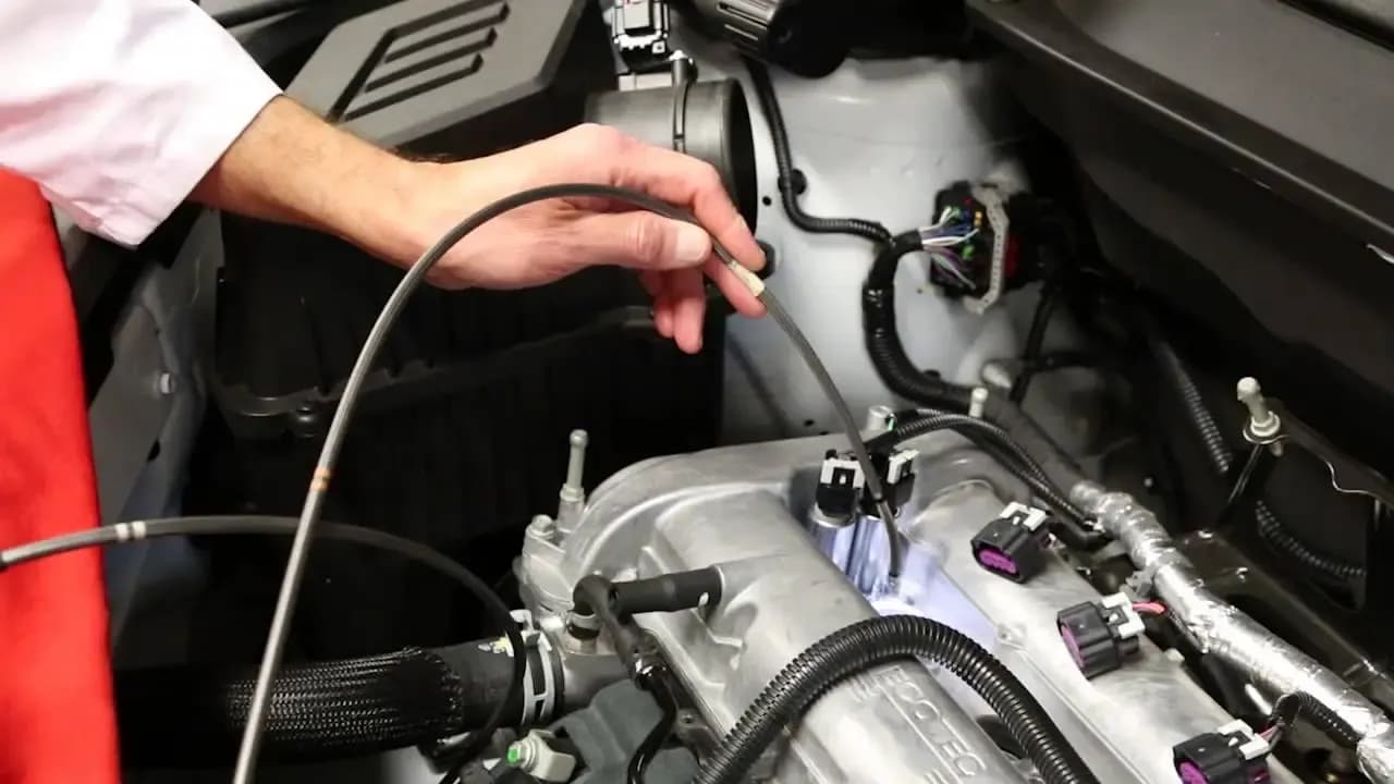 Mechanic checking fuel system components