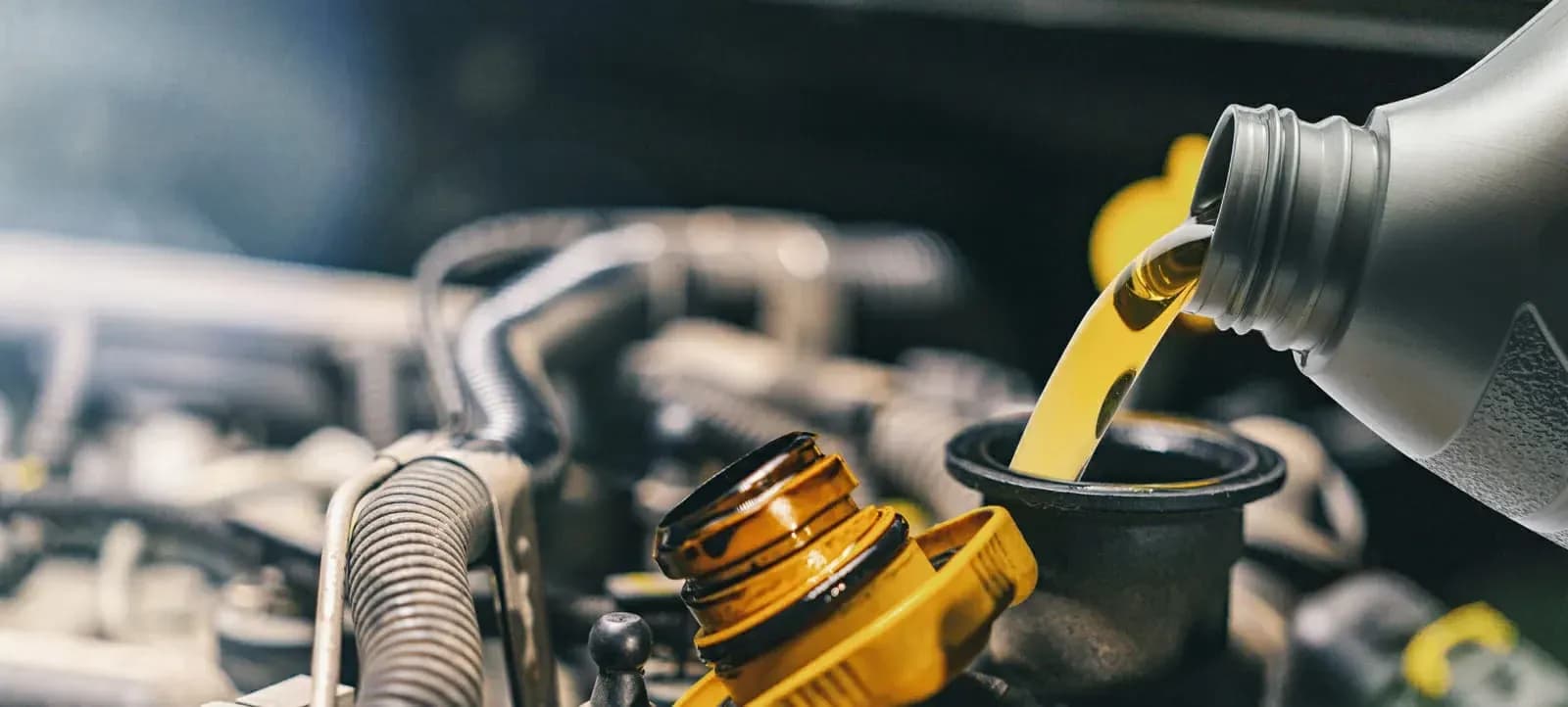 Engine oil being poured during a car service